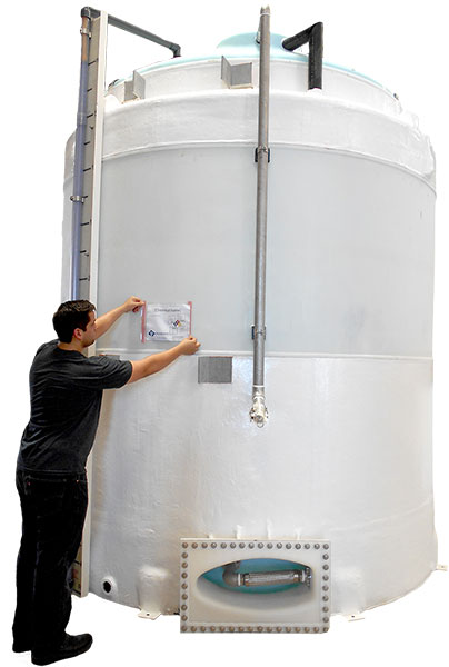 Safety Signage Being Placed on Large Tank
